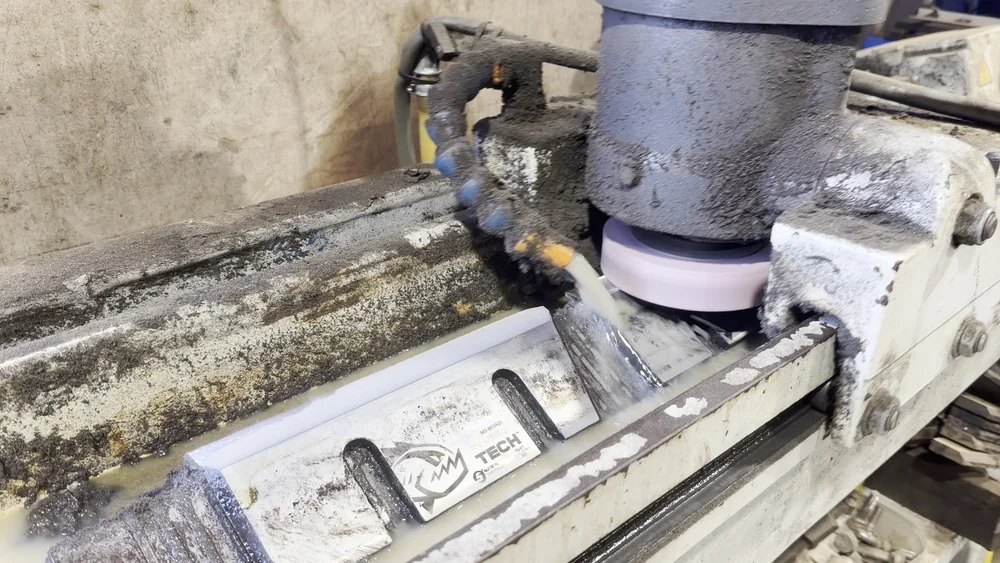 Chipper blade sharpening machine at our Leatherhead, Surrey yard Wood chipper blade clamped on a coolant-fed grinding machine being sharpened at our Leatherhead, Surrey yard
